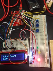 The circuitry for our original idea/design. The three blue potentiometers on the left would be turned to 0, 1, or 2 and the code would allow the total score to be displayed on the LCD. The LEDs would light according to the score range. We are still hoping to work a little more with Arduino because it is SO COOL.